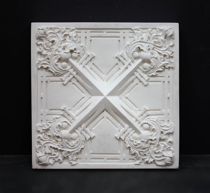 Photo of white plaster cast of architectural ornamentation detail