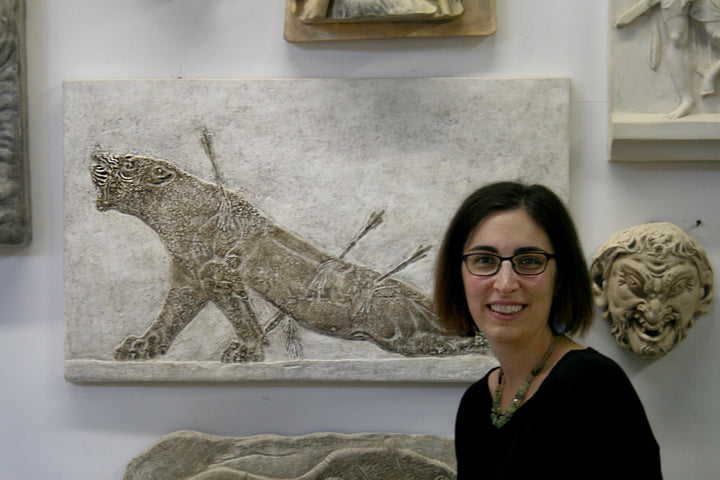 Photo of Lisa in the gallery with the Dying Lioness sculpture