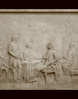 photo of off-white plaster cast relief sculpture of four men around a table aka signing the Treaty of Peace and Independence