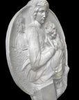 image of a round plaster relief sculpture of the Madonna and Child on a black background