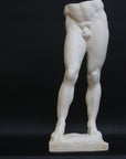 Photo of a decorative sculpture of a man's torso on a black background