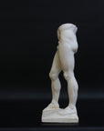 Photo of a decorative sculpture of a man's torso on a black background
