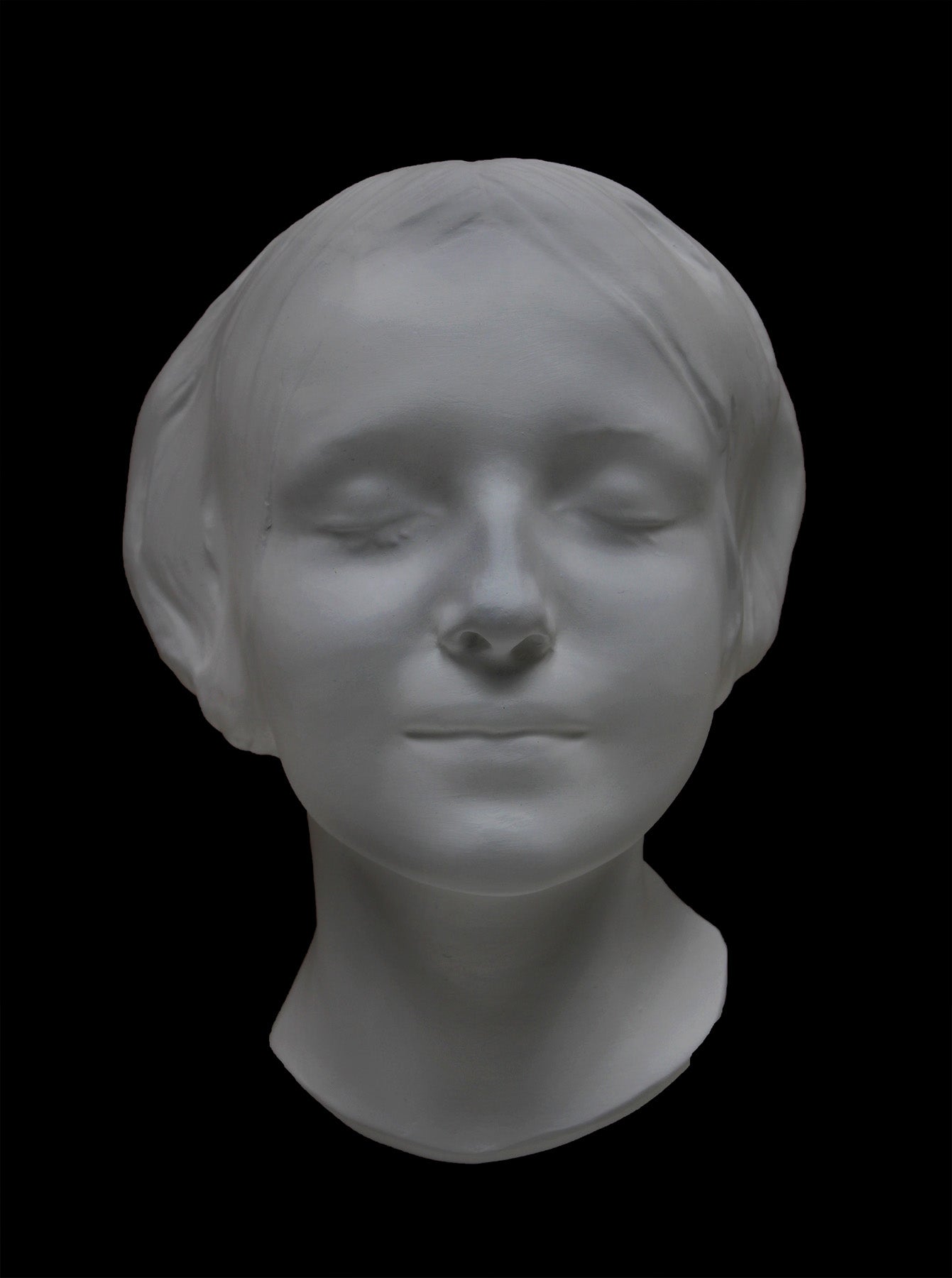 Photo of the mask of La Belle Italienne in white plaster on a black background