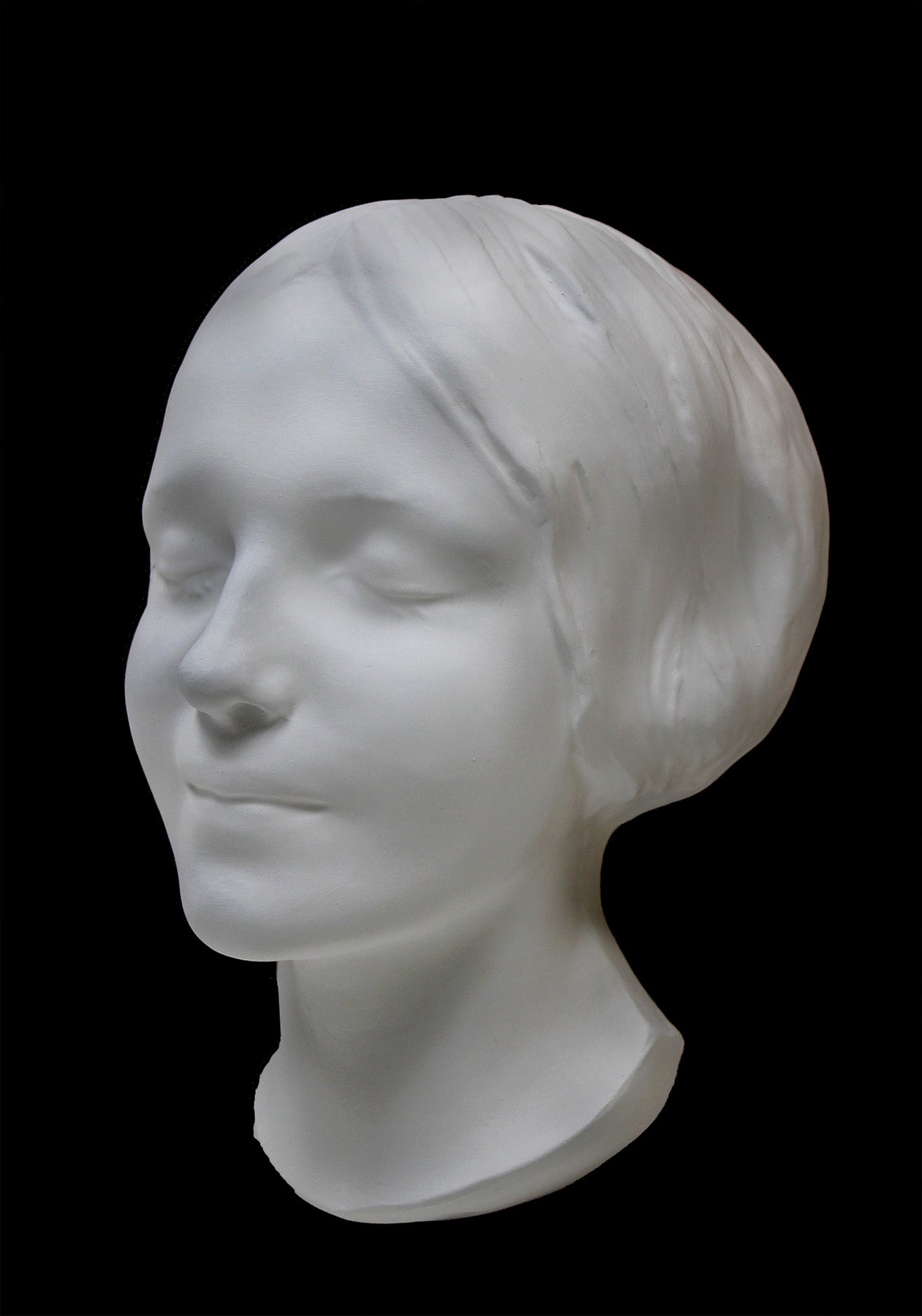 Photo of the mask of La Belle Italienne in white plaster on a black background