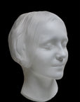 Photo of the mask of La Belle Italienne in white plaster on a black background