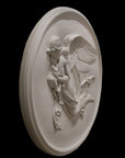 photo of plaster cast relief of woman with wings flying with two children nestled against her and an owl flying on a dark background