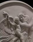 detail photo of plaster cast relief of female with wings flying and a cherub on her back on black background