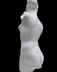 Photo of a sculpture of a female torso with a head