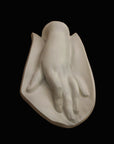 Photo of a plaster cast of a female hand
