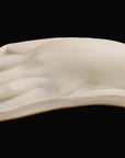 Photo of a plaster cast of a female hand