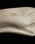 Photo of a plaster cast of a female hand