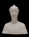 photo of white plaster cast of female bust with up-do and dress against black background
