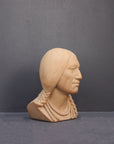 image of a terracotta-colored plaster bust of the well-known Native American Massasoit on a gray background