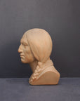 image of a terracotta-colored plaster bust of the well-known Native American Massasoit on a gray background