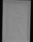 photo detail of plaster cast sculpture relief of the Madonna holding baby Jesus on her lap on black background