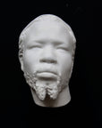 Photo of a sculpture of a Nubian head on a black background