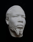 Photo of a sculpture of a Nubian head on a black background