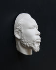 Photo of a sculpture of a Nubian head on a black background