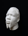 Photo of a sculpture of a Nubian head on a black background