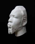 Photo of a sculpture of a Nubian head on a black background