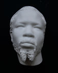 Photo of a sculpture of a Nubian head on a black background