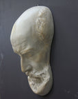 Photo of a sculpture of a St Jermone head on a gray background