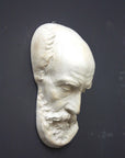 Photo of a sculpture of a St Jermone head on a gray background