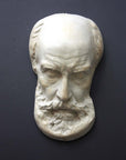 Photo of a sculpture of a St Jermone head on a gray background