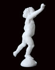 Photo of a sculpture of a cherub on a black background