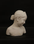 A photo of a sculpture of a Florentine girl on a black background