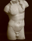 Photo of a decorative sculpture of a torso on a black background