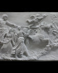 photo of a plaster cast sculpture relief of a woman, namely the goddess Aurora, flying and leading a chariot with a man pulled by horses towards the right while a cherub and other women fill the scene, on a black background