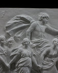 detail photo of a plaster cast sculpture relief of a woman, namely the goddess Aurora, flying and leading a chariot with a man pulled by horses towards the right while a cherub and other women fill the scene, on a black background