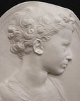 Photo of a sculpture of a little girl on a black background