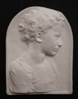 Photo of a sculpture of a little girl on a black background