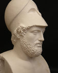 Photo of a sculpture of a man with a beard and a helmet, on a black background