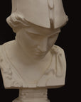 detail photo of plaster cast sculpture bust of female head, namely the goddess Minerva, with a helmet and looking down on black background
