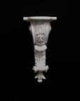 image of a plaster renaissance bracket on a black background