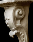 detail image of a plaster renaissance bracket on a black background