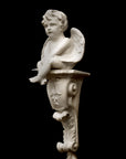 image of a plaster renaissance bracket with plaster sculpture of angel on a black background