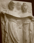 Photo of a sculpture of Cantoria Singers on a black background