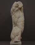 photo of plaster cast of sculpted flayed male torso on a gray background