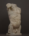 photo of plaster cast of sculpted flayed male torso on a gray background