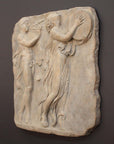 Photo of sculpture of 2 figures marching with musical instruments on a black background