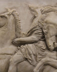 detail photo of off-white plaster cast relief sculpture of two men on horseback from Parthenon