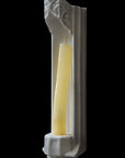 image of a plaster gothic sconce with candlestick on a black background