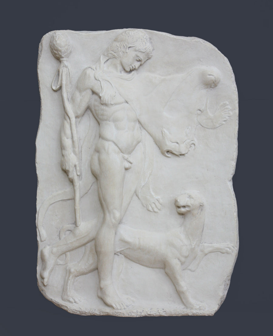 photo of white plaster cast relief sculpture of satyr with animal skin over his arm and staff in one hand walking beside a panther against gray background