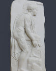 photo of off-white plaster cast relief sculpture of male nude with cloak bending to tie his sandal against gray background