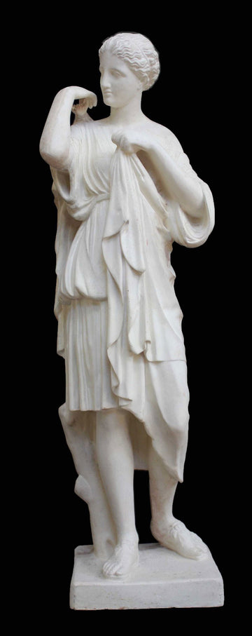 photo with black background of plaster cast of female figure, namely the goddess Diana, with robes about to clasp two pieces together at proper right shoulder