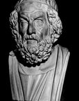 image of a plaster bust of homer on a black background